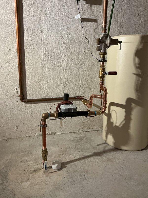 Coordinated with Independence Township for city water shut-off and restoration. Replaced second-floor toilet with ADA-compliant elongated white toilet, including new stop valve, supply line, and escutcheon for 1/2" copper straight connection. Removed and replaced drop-in utility sink with new unit, installed new stop valves and customer-supplied faucet, connected to existing drain line, and tested for proper operation. Rebuilt water meter assembly with new #1 and #2 meter valves, replaced SharkBite irrigation valve, and tied into existing riser. Installed expansion tank at water heater with copper piping connections and proper mounting. Inspected and addressed leaking kitchen faucet. All fixtures tested and verified operational upon completion.