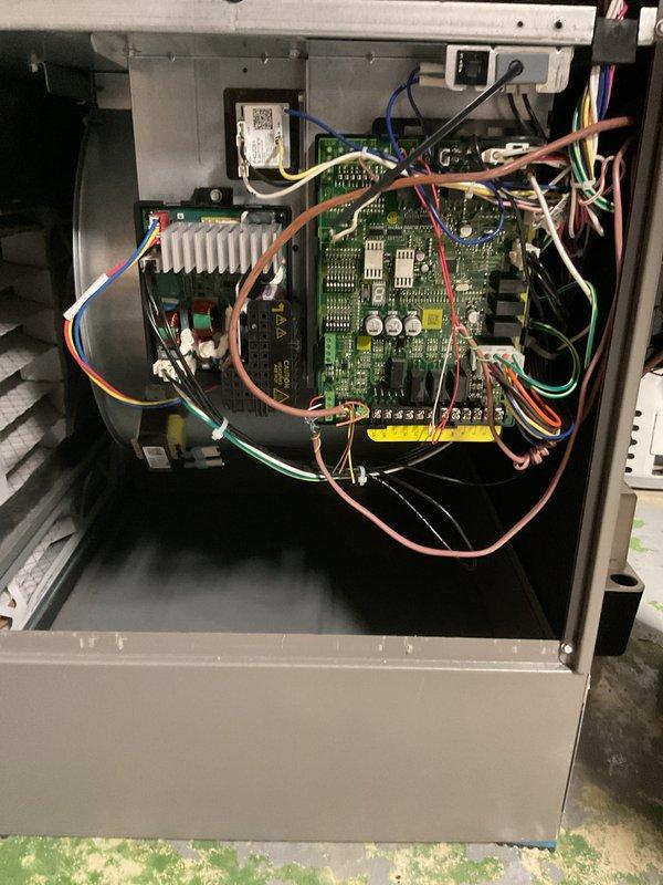 Completed comprehensive Gold-level preventive maintenance inspection on 2025 model year furnace and air conditioning system with equipment located in basement. Performed thorough examination of air handler unit including insulation integrity and cabinet components. Inspected and documented control board assembly, verifying all electrical connections, wire routing, and terminations at transformer, relay contacts, and PCB terminal points. Confirmed all electronic components, capacitors, and integrated circuits on main circuit board operating within normal parameters. System found to be in proper working condition with no immediate service needs identified at time of inspection.