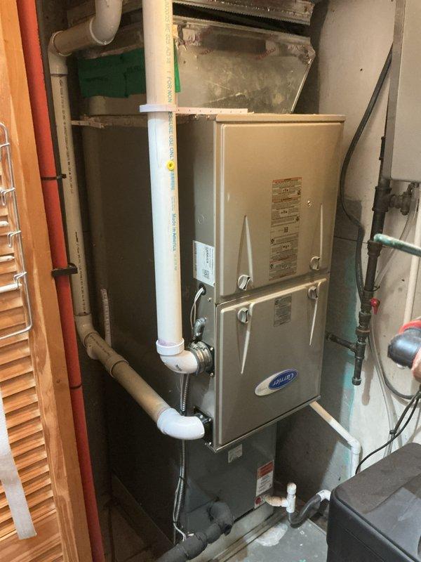 Completed comprehensive Gold-level furnace inspection on 5-year-old Carrier forced air system located in kitchen area. Performed full system evaluation including visual inspection of unit components, verified proper operation of thermostat and carbon monoxide detector, examined all PVC condensate drain lines and venting connections, and inspected gas and electrical connections. All equipment found operating within normal parameters with no deficiencies noted.