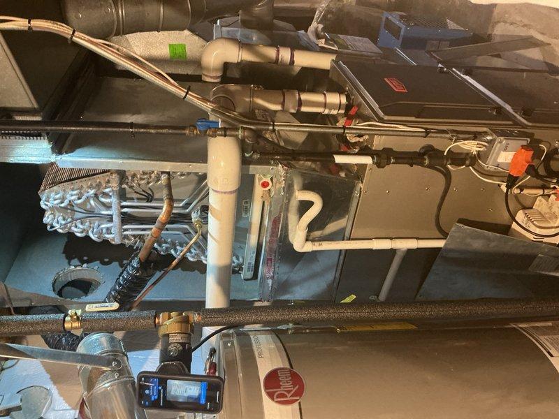 Responded to no-cooling complaint on 2-year-old basement air conditioning system. Upon inspection, diagnosed failed evaporator coil requiring replacement under warranty. Documented detailed photos of installation and surrounding area, noting active home renovation in progress. Ordered replacement evaporator coil from Lennox with expected delivery to warehouse, and coordinated with customer service regarding installation timeline once part arrives.