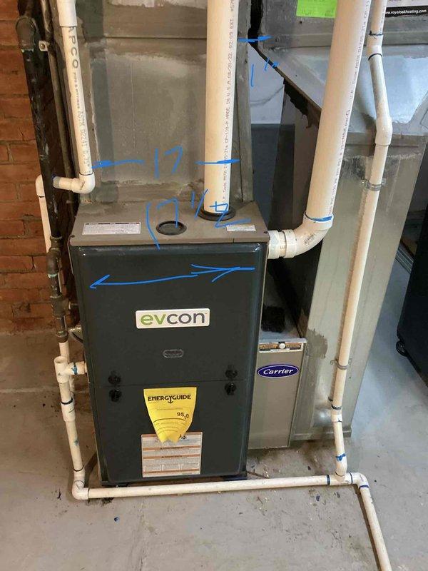 Completed comprehensive AC system evaluation for 19-year-old residential cooling equipment with outdoor condenser unit and basement evaporator coil. Performed detailed inspection and documentation of existing Evcon furnace and Carrier HVAC components, including assessment of ductwork configuration, PVC condensate drainage system, and air handling equipment. Marked and measured critical connection points throughout the system to provide accurate specifications for replacement estimate, identifying equipment age and configuration details necessary for proper system sizing and installation planning.
