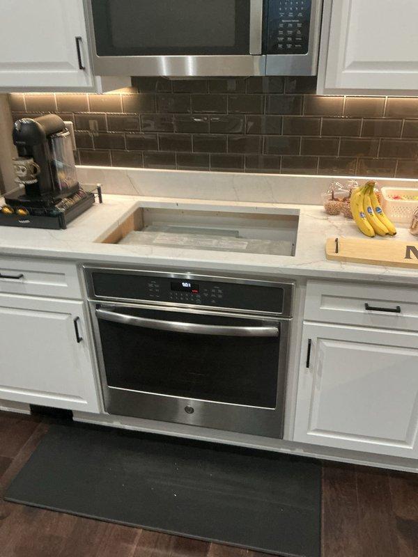 Installed new gas line from main supply to kitchen and completed installation of customer-supplied five-burner gas cooktop in white marble countertop. No existing gas line was present at the location, requiring full line run from source to appliance. Performed proper connections, tested all burners for functionality, and verified system integrity with leak detection procedures.