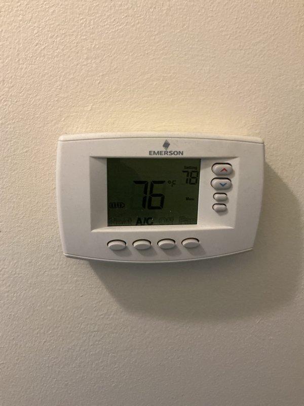 Completed comprehensive Gold-level furnace inspection on a 9-year-old forced air heating system located in the basement. Unit is currently operational with Emerson digital thermostat displaying 76°F set point in AUTO mode. Performed full system evaluation including visual inspection of furnace cabinet, ductwork connections, and utility room installation conditions per Gold maintenance protocol standards.
