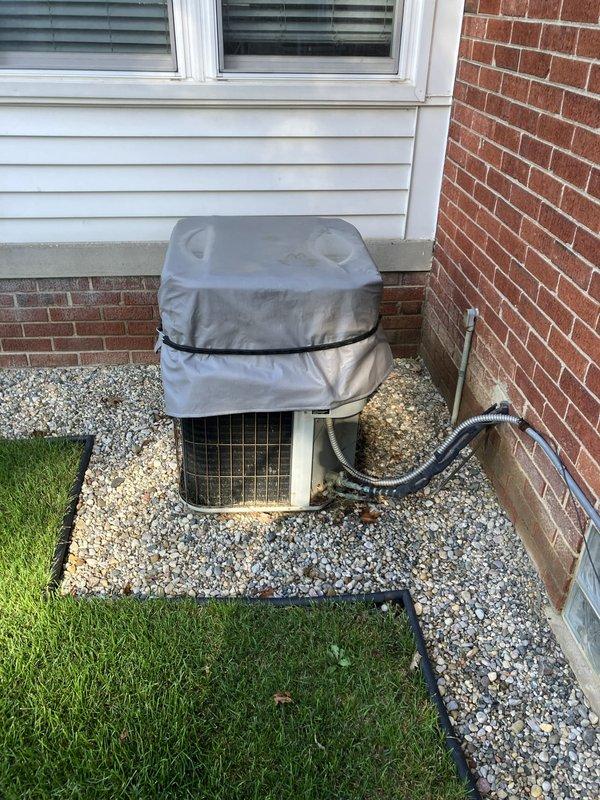 Completed comprehensive inspection and full system estimate for 26-year-old furnace located in basement. Evaluated existing Bryant humidifier unit, ductwork configuration, control systems, and thermostat operation. Assessed outdoor condensing unit condition with protective cover in place on gravel pad adjacent to foundation. Documented all system components including electrical connections, duct insulation, and overall equipment condition to provide complete replacement recommendations for aging HVAC system.