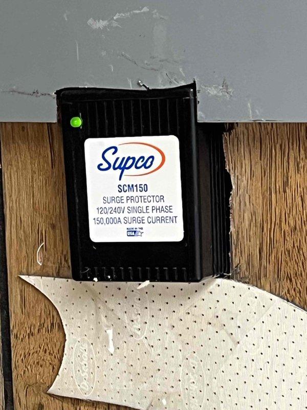 Completed Gold Furnace Inspection on 14-year-old unit located in basement. Replaced humidifier pad and furnace filter per customer request. Performed comprehensive combustion analysis using Bacharach analyzer, recording CO₂ at 7.3%, stack temperature at 107°F, ambient air temperature at 72.4°F, excess air at 55.3%, and carbon monoxide at 37 ppm. Verified surge protector (Supco SCM150, 120/240V single phase, 150,000A surge current rating) operational with green LED indicator illuminated. All measurements within acceptable operating parameters, and equipment functioning properly at time of inspection.