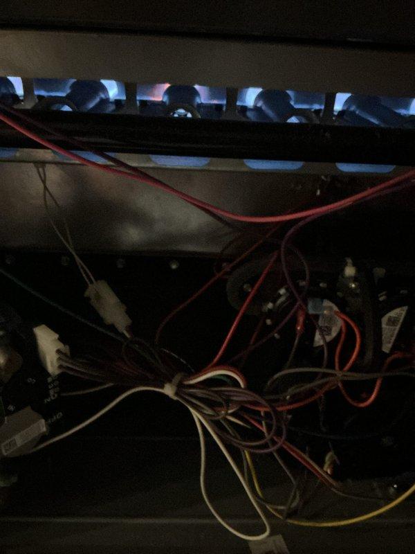 Completed scheduled maintenance tune-up on two-year-old gas furnace located in basement under active membership plan. Performed comprehensive system inspection including burner assembly operation verification, flame sensor analysis, and electrical control component examination. Inspected and assessed humidifier filter condition showing normal dust accumulation for service interval. All burners igniting properly with consistent blue flame pattern across assembly, indicating proper gas-air mixture and combustion efficiency. Verified all safety controls, limit switches, and wiring connections secure and functioning within manufacturer specifications. System operating at optimal performance with no deficiencies noted.