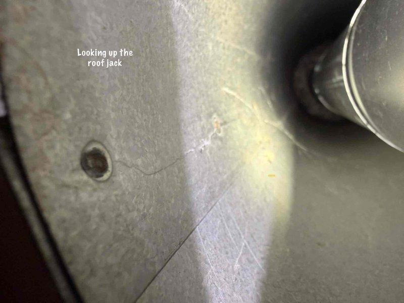 Responded to warranty call for 3-month-old hot water tank with pilot light failure and no hot water production. Investigated potential combustion air issue at bedroom closet installation. Inspected roof jack ventilation system and confirmed inadequate combustion air supply causing pilot safety lockout. Verified proper venting configuration and clearances for slim-profile unit installation requirements.