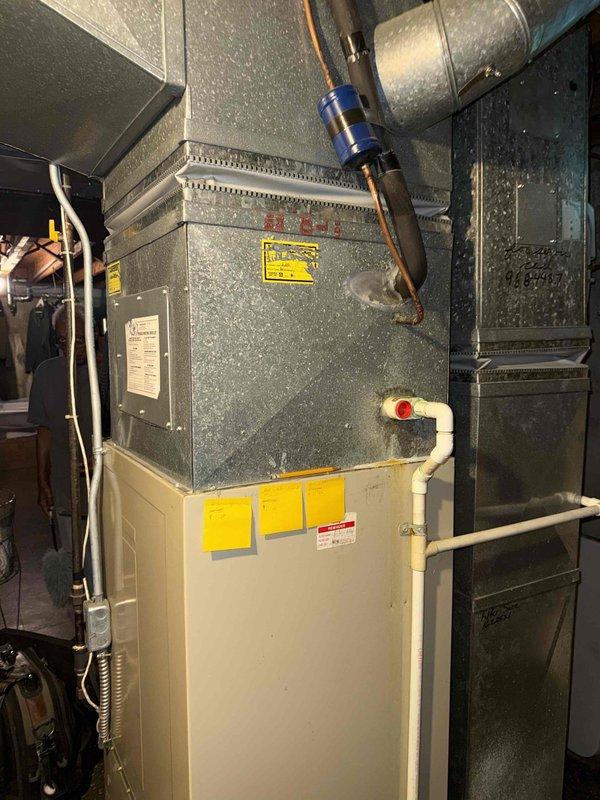 Responded to service call for humidifier upgrade on 15-20 year old furnace system located in basement. Removed existing drum-type humidifier unit and assessed HVAC system condition. Upon inspection, noted significant rust deterioration on air handler housing and aging ductwork components. Upgraded to new humidifier system, ensuring proper integration with existing forced-air furnace. Verified all connections, tested humidifier operation, and confirmed proper airflow through system. System returned to full operational status with enhanced humidity control capability.