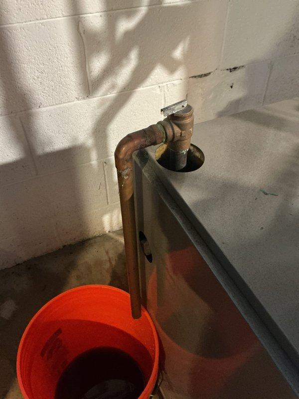 Responded to a water leak at boiler system where a valve was actively leaking. Upon inspection, identified the source as a faulty shut-off valve on the copper supply piping connected to the boiler circulator pump assembly. Tightened valve packing nut and verified leak was stopped. Inspected surrounding copper piping, brass fittings, and circulator pump for additional signs of corrosion or leakage; all components found to be in acceptable working condition. Removed collection bucket and advised monitoring system for 24-48 hours to ensure leak has been fully resolved.