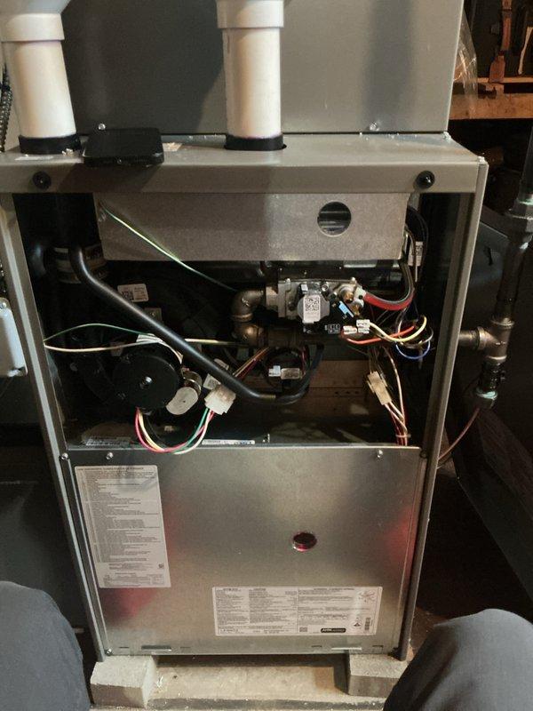 Completed comprehensive Gold AC Inspection and preventive maintenance on a 1.5-2 year old air conditioning system and heating furnace located in basement. Performed full system diagnostics, inspected all internal components including blower motor assembly, electrical connections, gas lines, and refrigerant lines. Verified proper operation of all mechanical and electrical systems, checked wire terminations and connections, examined PVC intake and exhaust venting, and confirmed all safety controls functioning correctly. No issues found; system operating within normal parameters.