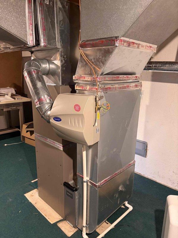Responded to no heat call on 4-year-old furnace located in basement. Upon arrival, confirmed unit was not operating. Performed diagnostic testing and determined blower motor had failed. Removed defective blower motor assembly using reciprocating saw to access mounting hardware. Ordered replacement blower motor from Dakota Supply Sterling Heights under PO 1368325-001 for installation upon arrival. Unit equipped with Carrier humidifier system, which was unaffected by the motor failure. Verified all ductwork connections and seals remained intact during disassembly process.