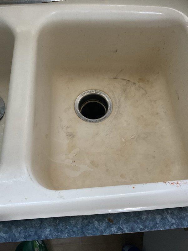 Responded to priority service call for garbage disposal maintenance on first floor kitchen unit. Upon arrival, inspected Badger 5 disposal system mounted beneath utility sink, noting visible staining and wear in basin around drain area. Performed comprehensive assessment of disposal unit, electrical connections, and associated PVC drainage plumbing. Verified proper mounting, tested operational functionality, and confirmed all connections secure. Unit restored to full working order with no leaks detected.