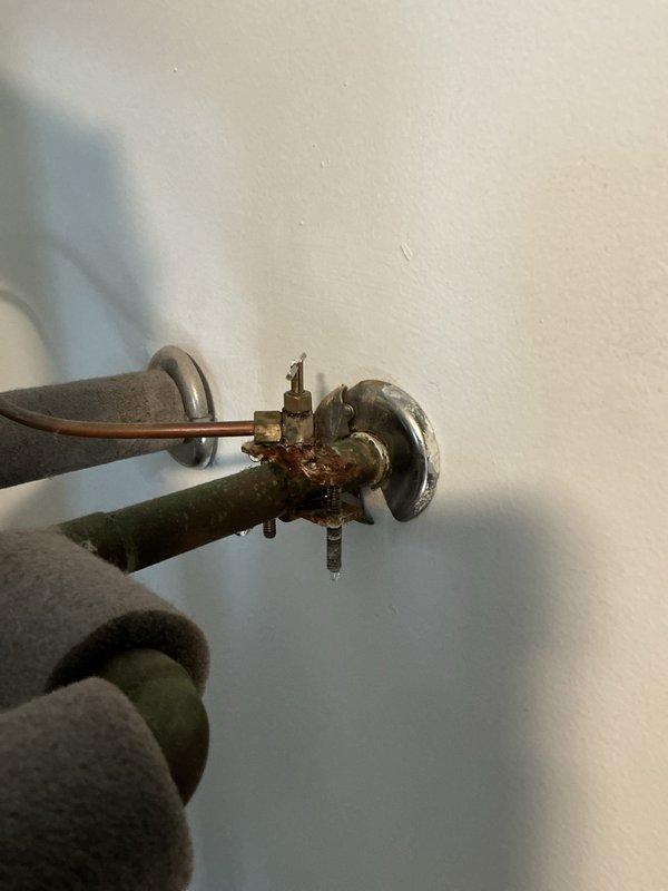 Completed comprehensive Gold Furnace Inspection on multi-unit HVAC system located in laundry room area. Performed thorough examination of furnace internal components including blower motor assembly, gas valve, electrical connections, and control board. Inspected all wire connections and verified proper securing with zip ties. Evaluated ductwork connections and mounting hardware for integrity. Assessed gas supply valve and associated plumbing connections, noting age-related surface oxidation on brass components. Confirmed all furnace systems operating within normal parameters. Unit is functioning properly with no immediate service concerns identified.