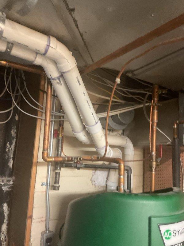 Responded to flame rod warning on a 50-gallon short power vent water heater installed in 2021. Inspected the unit and associated plumbing connections in the basement utility area. The flame rod sensor was cleaned and tested to ensure proper flame detection and safe operation. Verified power vent operation, gas supply connections, and all copper supply lines for proper function. Cleared the warning code and confirmed the water heater returned to normal operation with proper ignition sequence and flame sensing capability.