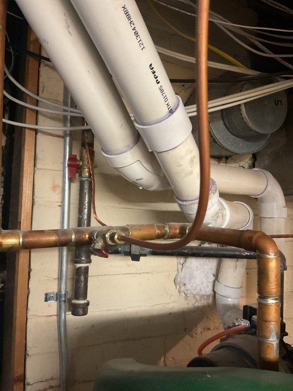 Responded to flame rod warning on a 50-gallon short power vent water heater installed in 2021. Inspected the unit and associated plumbing connections in the basement utility area. The flame rod sensor was cleaned and tested to ensure proper flame detection and safe operation. Verified power vent operation, gas supply connections, and all copper supply lines for proper function. Cleared the warning code and confirmed the water heater returned to normal operation with proper ignition sequence and flame sensing capability.
