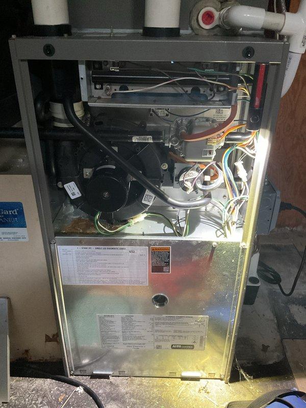 Completed comprehensive Gold Furnace Inspection on 12-year-old forced air heating system located in basement. Performed full visual inspection of all internal components including gas valve assembly, flame sensor rod, blower motor, heat exchanger, burner compartment, control board, and electrical connections. Verified proper operation of all safety controls, tested flame detection system, and inspected venting and drainage systems. All components found to be functioning within normal parameters with no immediate service needs identified. Unit photographed and documented for maintenance records.