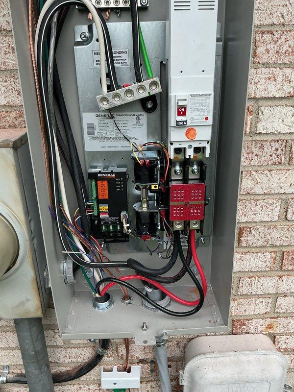 Completed installation of 24kW Generac standby generator system with automatic transfer switch mounted on exterior brick wall. Installed RXSW150A3 Generac Transfer System with proper electrical connections including heavy-gauge supply and load conductors, grounding system, and control module wiring with AC circuit monitoring capabilities. All electrical, mechanical, gas piping, and generator permits were obtained and installation was performed to code requirements with transfer switch properly configured for automatic operation during utility power loss.