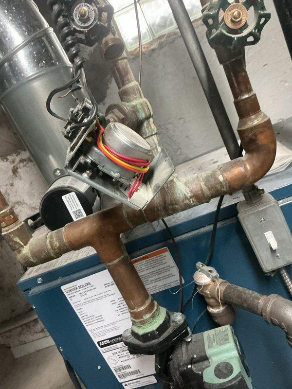 Responded to service call for bedroom thermostat that would not shut off in a multi-zone hydronic heating system. Diagnosed faulty zone valve operation preventing proper zone isolation. Replaced defective Honeywell 2-wire zone valve on bedroom heating zone with new unit from shop stock. Verified proper thermostat control, zone valve cycling, and system operation across all zones upon completion.
