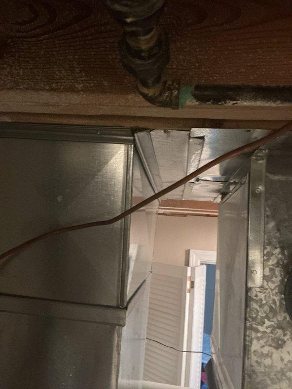 Completed plumbing estimate for gas line installation to convert existing wood-burning fireplace to gas operation in family room. Assessed routing from existing household gas service to fireplace hearth location, documented current gas infrastructure including water heater and utility connections in basement area, and evaluated access path through floor joists and ductwork for new copper gas line installation.