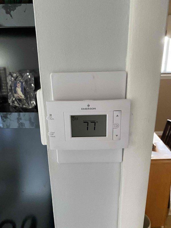 Responded to service call for complete HVAC system failure following electrical repairs after storm-related power surge. Upon arrival, confirmed both heating and cooling systems inoperative with thermostat displaying OFF mode at 77°F. Evaluated 20-year-old furnace located in basement and 5-year-old central air conditioning unit. After diagnostic assessment of both systems and consideration of equipment age, power surge damage, and repair costs versus replacement value, provided comprehensive estimate for complete HVAC system replacement to restore heating and cooling functionality to residence.