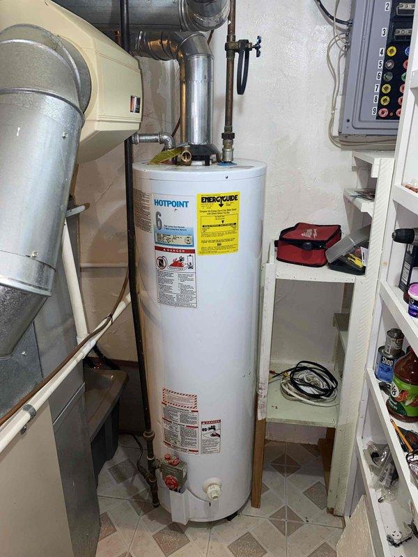 Responded to service call for complete HVAC system failure following electrical repairs after storm-related power surge. Upon arrival, confirmed both heating and cooling systems inoperative with thermostat displaying OFF mode at 77°F. Evaluated 20-year-old furnace located in basement and 5-year-old central air conditioning unit. After diagnostic assessment of both systems and consideration of equipment age, power surge damage, and repair costs versus replacement value, provided comprehensive estimate for complete HVAC system replacement to restore heating and cooling functionality to residence.