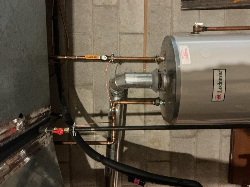 Completed comprehensive Gold Furnace Inspection on 10-year-old forced air unit located in basement. Performed full system evaluation including visual inspection of all accessible components, heat exchanger examination, burner assembly assessment, and safety control testing. Inspected ductwork connections, venting system, and associated piping. Noted visible corrosion on copper pipe fittings and connections near furnace area, with mineral deposits present on brass fittings. Verified proper operation of all furnace controls and safety mechanisms. Unit currently operating within normal parameters. Documented equipment condition with photographic evidence showing aging components and connection points requiring monitoring for future maintenance planning.