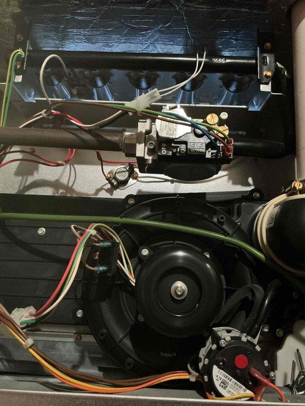 Completed comprehensive Gold-level maintenance inspection on residential forced-air furnace system (approximately 6 years old) located in basement and outdoor Bryant air conditioning unit (approximately 5 years old). Performed thorough examination of furnace internal components including blower motor assembly, electrical connections, control relay module, and all associated wiring terminals. Inspected exterior condensing unit, verified proper mounting on concrete pad, examined condenser coil fins, checked fan guard assembly, and assessed overall equipment condition. All systems found operational with no immediate service needs identified during inspection.