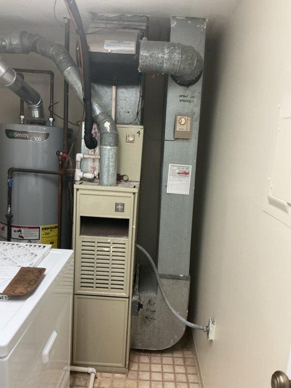 Provided comprehensive estimate for natural gas furnace replacement in utility room. Current 10+ year old unit is operational but customer seeking replacement options. Evaluated existing HVAC configuration including ductwork connections, gas line routing, and clearance requirements in confined mechanical space shared with water heater and electrical panel.