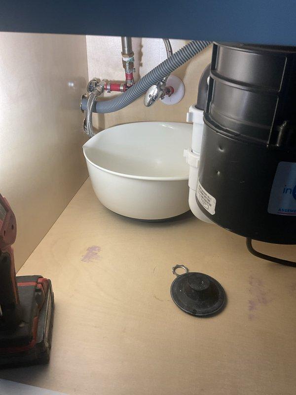 Responded to service call for faucet replacement and minor leak beneath bathroom sink. Upon inspection, identified leak originating from deteriorated supply line connections. Successfully replaced existing faucet assembly with new fixture, installed new braided stainless steel supply lines to both hot and cold water connections, and verified proper sealing at all connection points. Tested water flow and pressure at faucet, confirmed garbage disposal unit remained properly connected and functional, and inspected all under-sink plumbing for additional leaks. All connections secured and leak resolved.