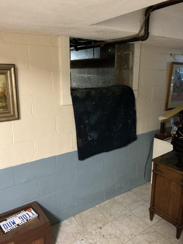 Responded to service call for non-operational air conditioning unit with water detection alarm activated in basement. Upon inspection, found condensate drain pan beneath furnace had triggered high water level safety switch, causing red indicator light and system shutdown. Cleared condensate line blockage, verified proper drainage, and tested safety float switch operation. Performed requested furnace inspection on 4-5 year old unit, confirming all components operating within normal parameters. Reset system and verified air conditioning unit returned to normal operation with proper condensate removal.