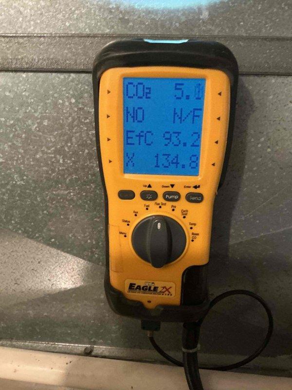 Responded to service call for non-operational air conditioning unit with water detection alarm activated in basement. Upon inspection, found condensate drain pan beneath furnace had triggered high water level safety switch, causing red indicator light and system shutdown. Cleared condensate line blockage, verified proper drainage, and tested safety float switch operation. Performed requested furnace inspection on 4-5 year old unit, confirming all components operating within normal parameters. Reset system and verified air conditioning unit returned to normal operation with proper condensate removal.