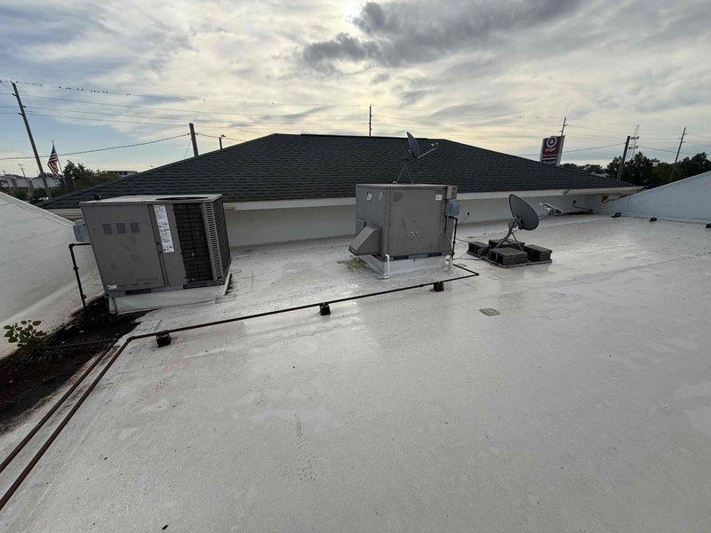Completed scheduled filter change maintenance on two rooftop units at commercial facility. Accessed roof-mounted RTUs and removed existing filters showing moderate dust accumulation and discoloration from normal operation. Installed new replacement filters in both units to restore proper airflow and system efficiency. All units operational upon completion with improved air filtration performance.