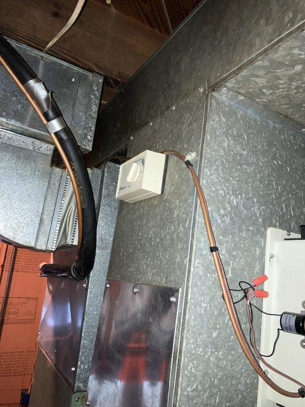 Conducted comprehensive site evaluation of existing HVAC system located in attic space for air conditioning replacement estimate. Assessed current equipment configuration including air handler unit with associated ductwork, refrigerant lines, and condensate pump assembly. Documented system layout, equipment accessibility, existing copper line sets with insulation, electrical connections, and mechanical components to provide accurate replacement recommendations for residential cooling system upgrade.