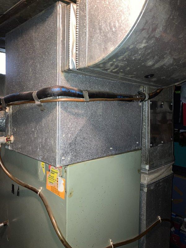 Conducted comprehensive site evaluation of existing HVAC system located in attic space for air conditioning replacement estimate. Assessed current equipment configuration including air handler unit with associated ductwork, refrigerant lines, and condensate pump assembly. Documented system layout, equipment accessibility, existing copper line sets with insulation, electrical connections, and mechanical components to provide accurate replacement recommendations for residential cooling system upgrade.