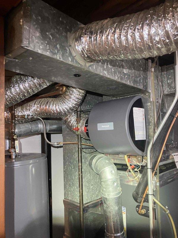 Completed comprehensive Gold-level furnace inspection on 2019 forced-air heating system located in basement. Performed thorough examination of furnace unit, ductwork connections, and integrated humidification system. Verified all mechanical components operating properly, inspected flex duct connections and PVC condensate drainage, checked electrical connections and safety controls, and confirmed humidifier function with proper water supply connections. All equipment found in good working condition with no immediate service needs identified.
