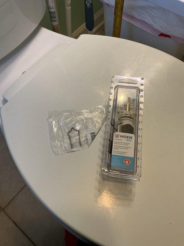 Replaced worn Moen cartridge in shower valve control. Removed existing cartridge showing signs of age and wear, installed new OEM Moen replacement cartridge to restore proper temperature control and operation. Fixture now functioning correctly with smooth handle operation and proper hot/cold water mixing.
