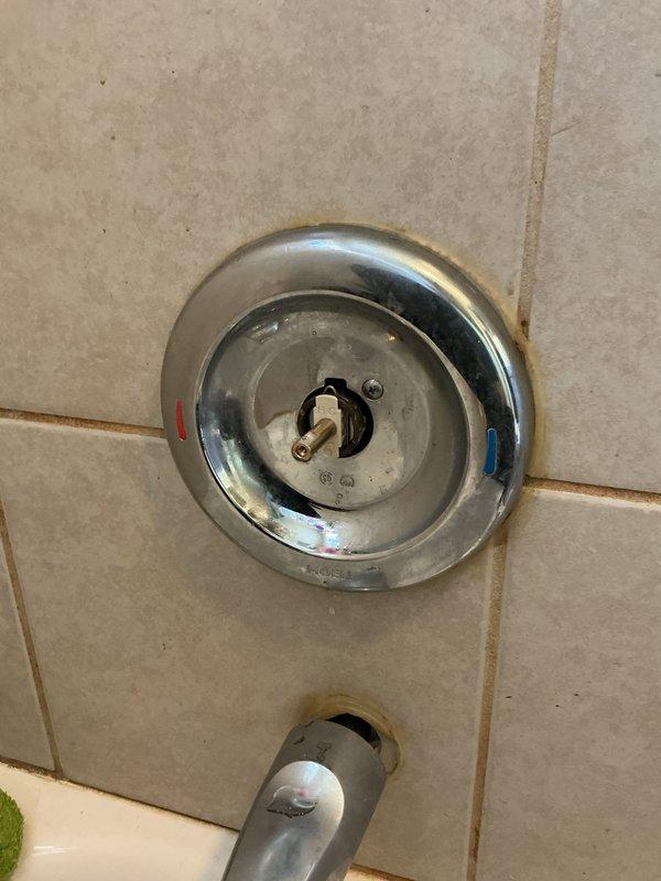 Replaced worn Moen cartridge in shower valve control. Removed existing cartridge showing signs of age and wear, installed new OEM Moen replacement cartridge to restore proper temperature control and operation. Fixture now functioning correctly with smooth handle operation and proper hot/cold water mixing.