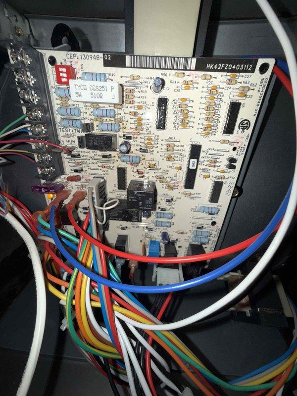 Completed comprehensive Gold-level furnace inspection on 10+ year old forced air system located in basement. Performed thorough examination of all major components including heat exchanger, blower assembly, control board (model HK42FZ040), electrical connections, and condensate drainage system. Replaced 20x25x4 air filter as requested. Inspected control board wiring and connections, verified proper operation of all colored wire terminations and electronic components. Examined condensate pan and drain assembly, noting normal dust accumulation consistent with unit age. Verified all safety controls, limit switches, and electrical connections are functioning properly. System is operating within normal parameters with no immediate safety concerns identified.