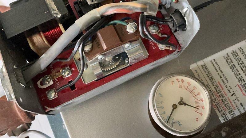 Completed annual heating maintenance and tune-up on 20-year-old boiler system. Performed comprehensive inspection of internal components including electrical controls, ignition assembly, copper coil connections, and pressure gauges. Verified all control knobs, indicator lights, and safety mechanisms functioning properly. System tested and confirmed operational with no issues found.
