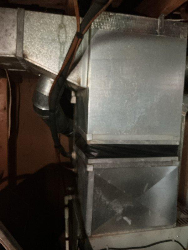 Completed estimate for replacement of 1998 AC condenser system serving basement-located equipment with natural gas furnace. Existing unit running but failing to provide adequate cooling capacity, requiring full system replacement evaluation. Documented existing ductwork configuration, plenum assembly, and mechanical infrastructure to determine proper replacement specifications.