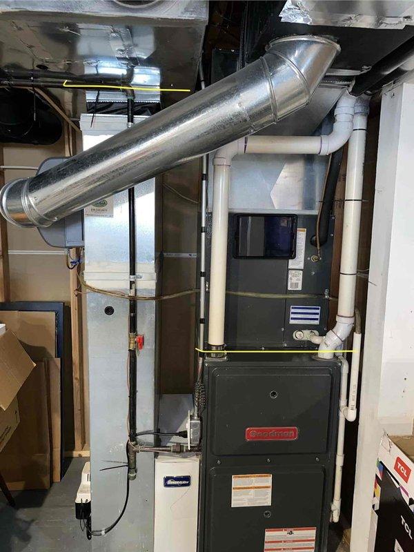 Provided comprehensive replacement estimate for 11-year-old natural gas furnace currently located in basement. Unit is operational but customer seeking replacement options. Evaluated existing Goodman furnace installation, ductwork configuration including diagonal supply plenum, PVC venting system, and current digital thermostat setup to determine appropriate replacement specifications and installation requirements.