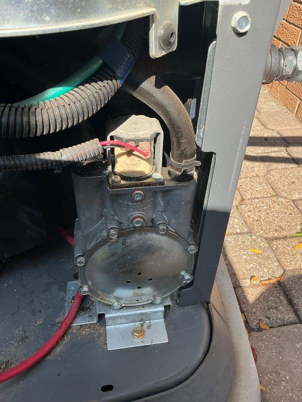 Responded to service call for 22kW Generac generator that had been running continuously for two days with reported gas odor. Upon inspection, identified faulty gas regulator as source of issue. Ordered replacement gas regulator from Generac for pickup at shop under purchase order, with estimated arrival in five business days. Documented equipment condition and components including compressor assembly, refrigerant lines, and gas connection fittings. Unit temporarily shut down pending parts arrival and installation to resolve gas leak concern.