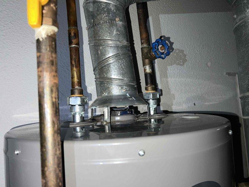 Completed comprehensive Gold Furnace Inspection on 3-year-old furnace unit located in basement. Performed full system diagnostics including visual inspection of all components, verified proper operation of blower motor and heat exchanger, checked gas connections and electrical systems, and confirmed all safety controls functioning within normal parameters. Inspected water heater plumbing connections during routine maintenance, noting visible corrosion on copper piping and darkening on pipe surfaces that may require future monitoring. Tested temperature differentials and system pressures, documenting return air dry bulb at 85.1°F and supply air readings at 133.6°F, indicating proper heat rise across the heat exchanger. Verified all mechanical connections secure, inspected ductwork for proper sealing, and confirmed blue shutoff valve operational. System operating efficiently with no immediate repairs required; all components within manufacturer specifications for equipment age.