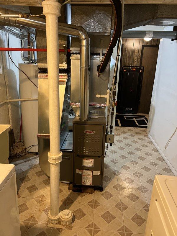 Completed installation of new Lennox furnace system in basement utility area, including new thermostat and all associated ductwork connections. Permit was requested and financing approved prior to installation, with all work performed to manufacturer specifications and local code requirements.