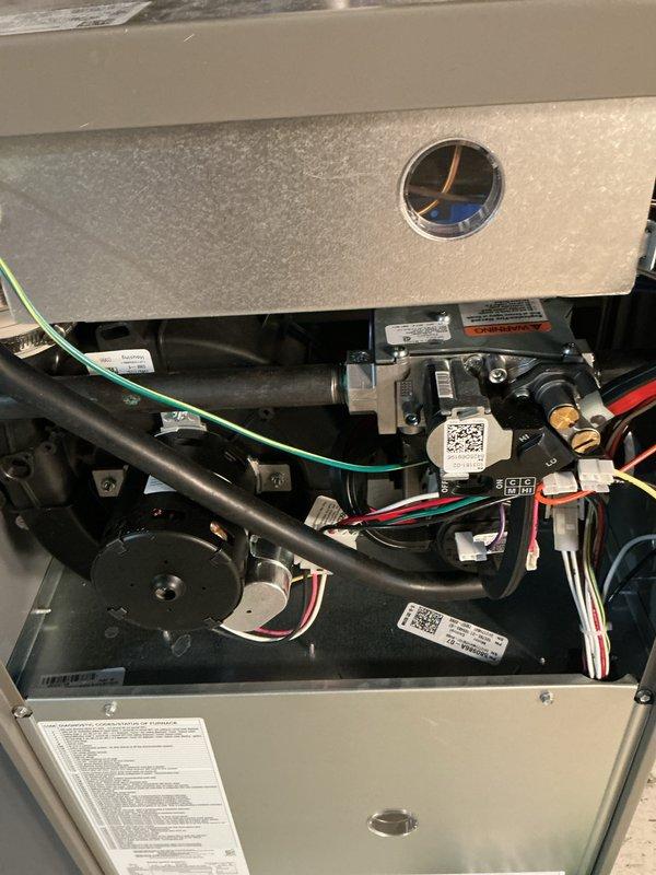 Completed annual Gold Plan furnace inspection on one-year-old unit. Performed comprehensive system evaluation including visual inspection of all internal components, gas valve assembly, electrical connections, and blower motor. Conducted combustion analysis testing using Testo 310 analyzer to verify proper efficiency and safe operation. Verified humidistat control settings and ductwork connections. All components operating within manufacturer specifications with no deficiencies noted. System found in excellent condition with no repairs required.