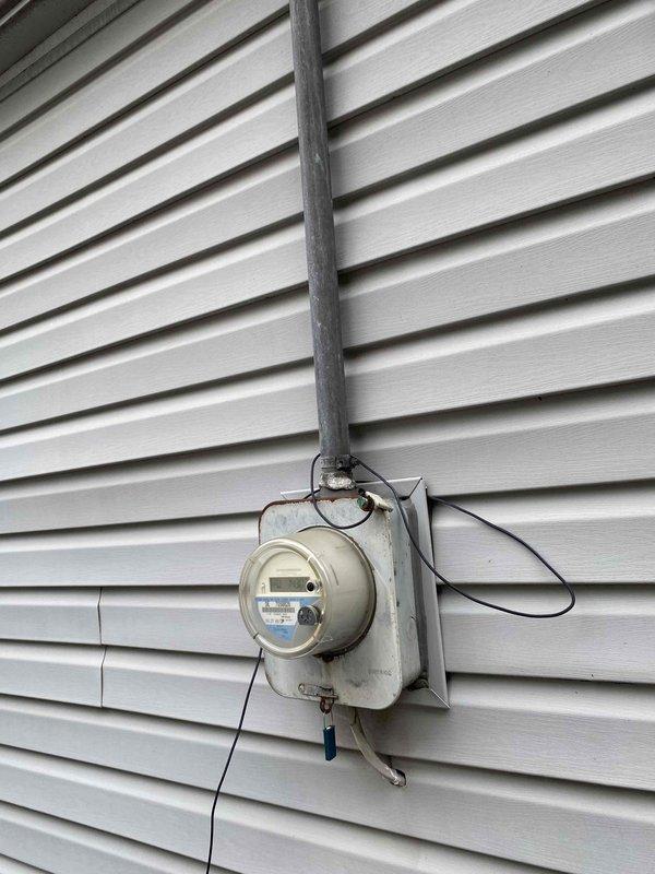Responded to service call for 15-year-old air conditioning system located in attic that was not operational. Performed comprehensive system evaluation and documented existing electrical infrastructure including main breaker panel, circuit directory, and exterior meter installation. Provided replacement estimate for complete HVAC system due to age and non-functional status of equipment.