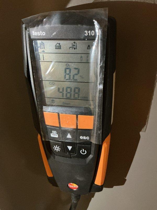 Completed comprehensive Gold Furnace Inspection on two forced-air heating units located in basement, including a 2025 model and a 2009 Goodman unit (model AMH950904CXAF). Performed combustion analysis using Testo 310 analyzer, which measured carbon monoxide levels at 499 ppm and temperature at 82°F. Conducted full safety inspection, verified proper operation of both systems, documented equipment conditions with photographs, and confirmed all components functioning within normal parameters.