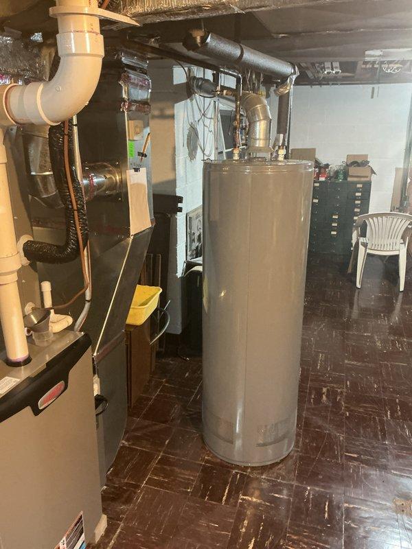 Completed comprehensive Gold-level furnace inspection on 2-year-old heating system located in basement mechanical room. Performed thorough visual examination of furnace components, verified thermostat operation and programming settings, inspected heat exchanger for cracks or deterioration, checked all electrical connections and safety controls, tested ignition system and burner assembly, examined venting and flue pipe for proper installation and clearances, verified adequate combustion air supply, and inspected gas line connections for leaks. Thermostat displaying proper temperature readings and functioning correctly in program hold mode. All furnace components operating within manufacturer specifications with no immediate safety concerns identified. System ready for heating season operation.