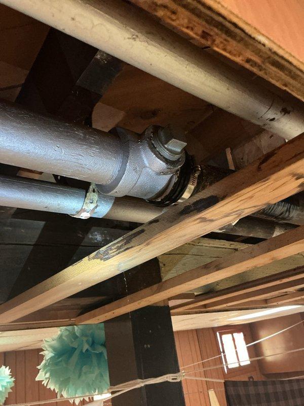 Responded to service call for piping estimate in basement area. Upon inspection, identified significant moisture issues with heavy frost and ice buildup on metal ductwork and condensation on PVC piping, indicating temperature differential problems. Confirmed presence of asbestos-containing materials on existing piping system that requires professional abatement prior to any repair or replacement work. Documented conditions with photographs and advised homeowner that piping replacement cannot proceed until certified asbestos removal is completed in affected area.