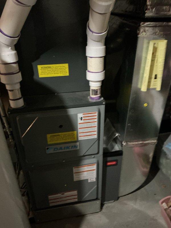 Completed preventative maintenance tune-up on 7-year-old Daikin furnace located in basement. Performed comprehensive system inspection including burner assembly, heat exchanger, ignition system, and blower motor operation. Verified proper venting through PVC exhaust system, checked all electrical connections, tested safety controls, and confirmed adequate airflow throughout the unit. System operating within manufacturer specifications with no immediate concerns identified.